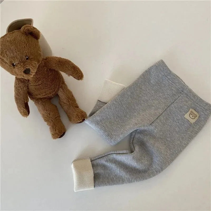 Girls' high-waist fleece-lined leggings in beige, black, brown, or grey colour.
