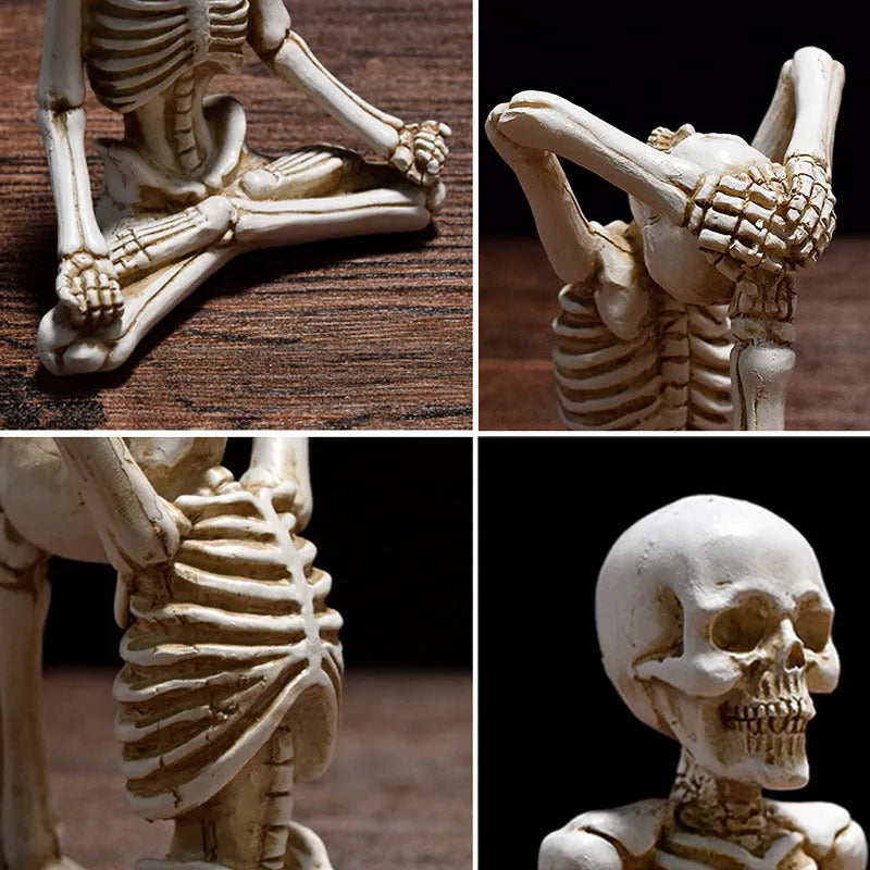 Hand-painted resin yoga pose skull skeleton ornament measuring 10.5-11cm wide on wooden desktop