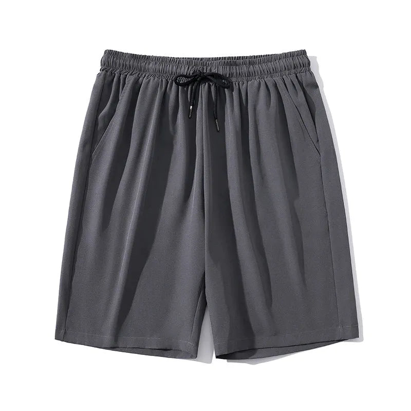 Men's cropped sports pants in blue with quick-drying nylon fabric and elastic waistband