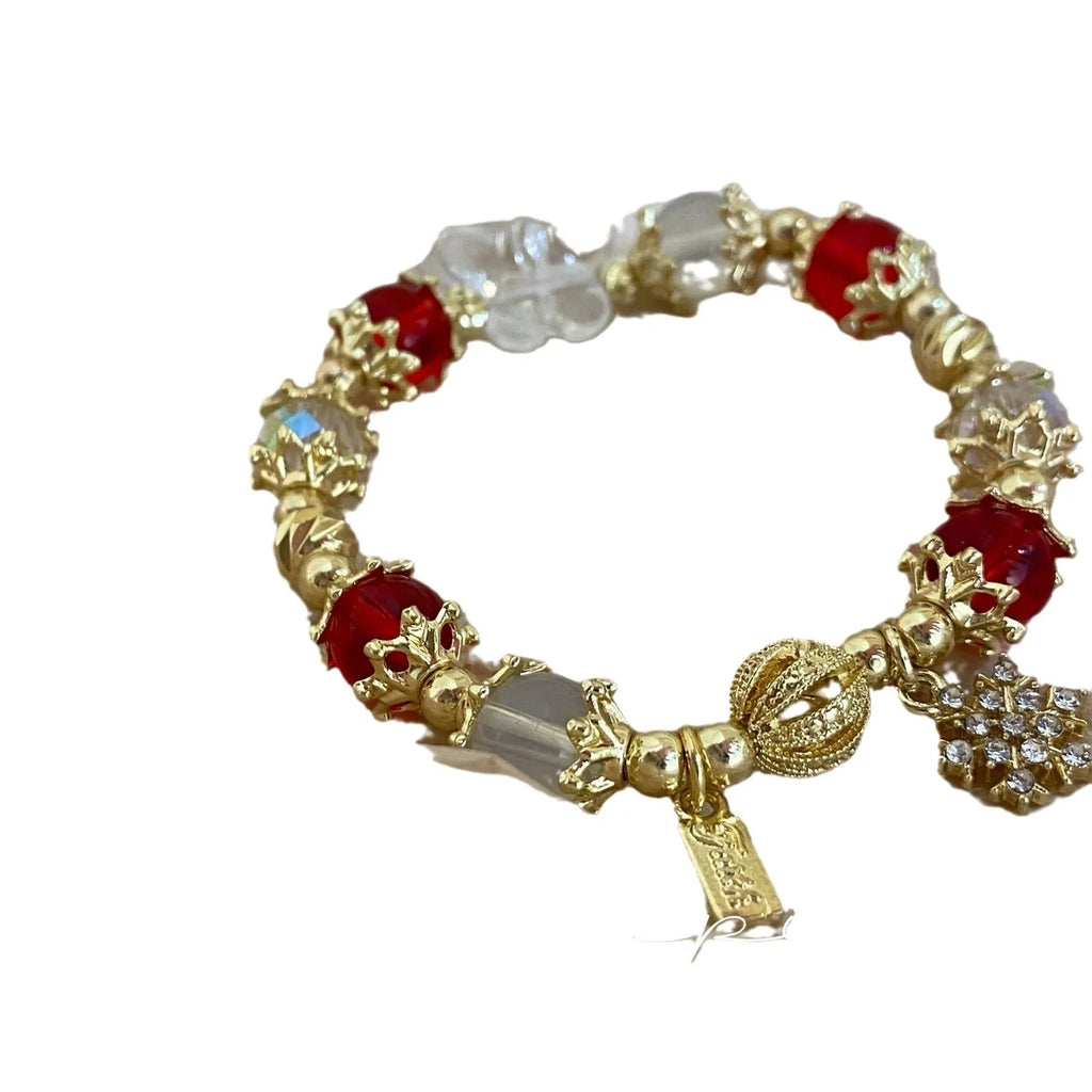 Galaxy-coloured women's alloy bracelet with snowflake pendant and bow charm.