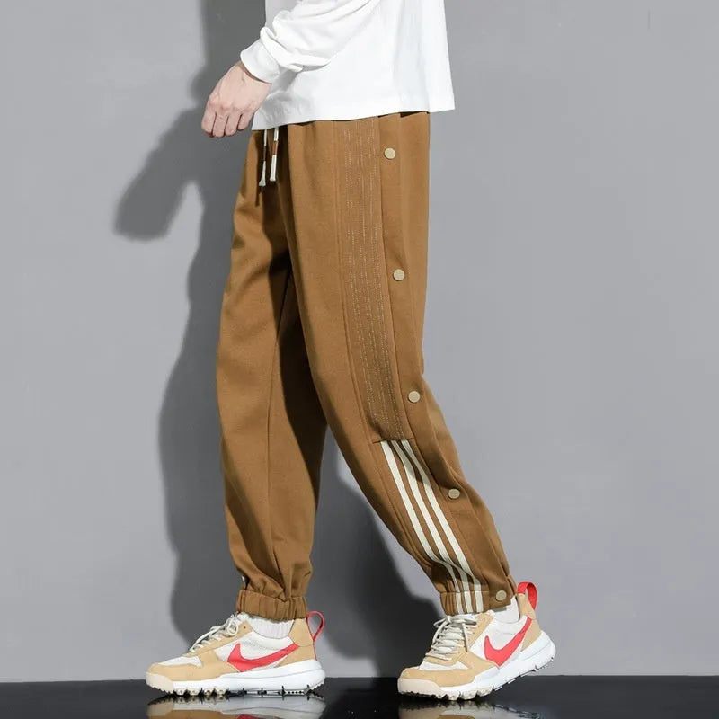 Men's ankle-tied sports pants in autumn colours with high waist and drawstring closure, sizes M to 6XL