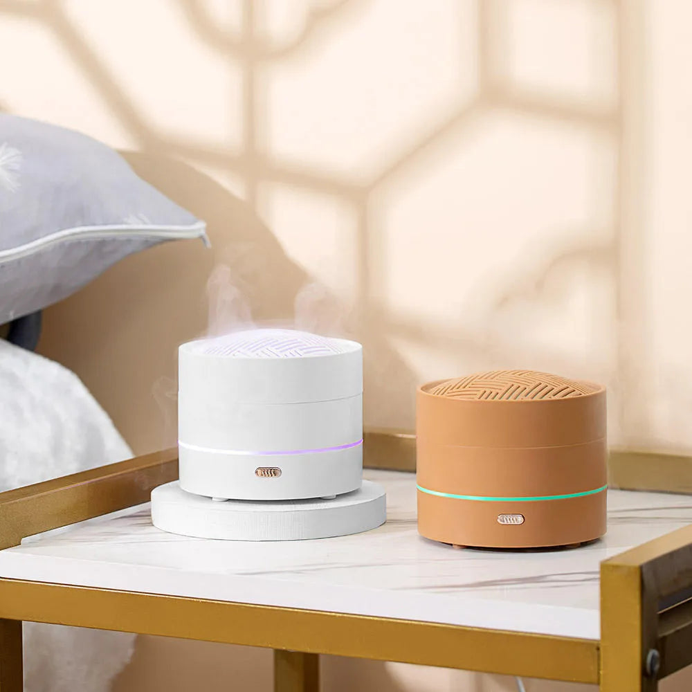 200ml USB ultrasonic aroma diffuser with four-spray design, steaming bun shape, and LED night light in Coffee or White