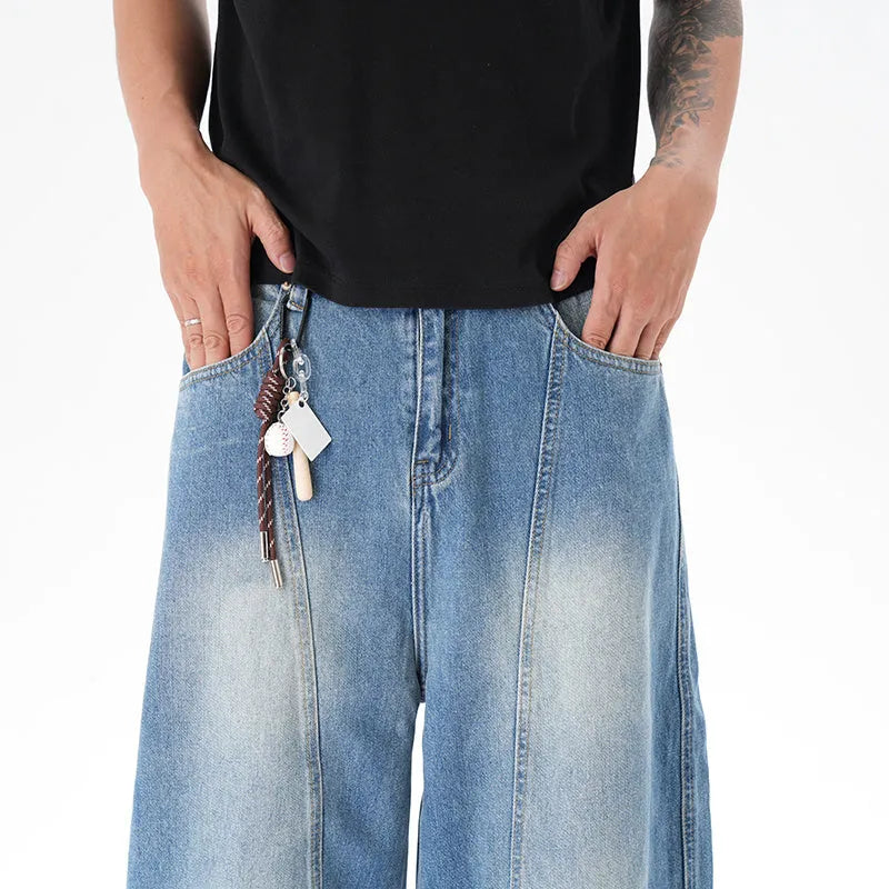 Light blue vintage washed wide leg denim jeans with a zipper fly on a mannequin.