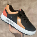 Men's casual shoes with round toe design in artificial PU material, showing white with orange accent colour option