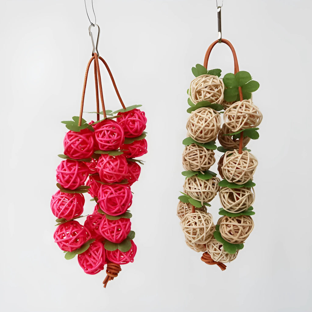 Natural rattan parrot chew toy, 20 cm long, 35 g, with hanger, shown in pink or primary colour for birdcages