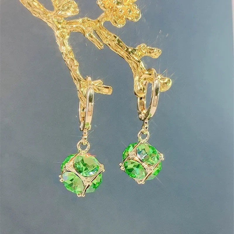 A pair of geometric-shaped zircon and rose element earrings for women, made from electroplated copper.