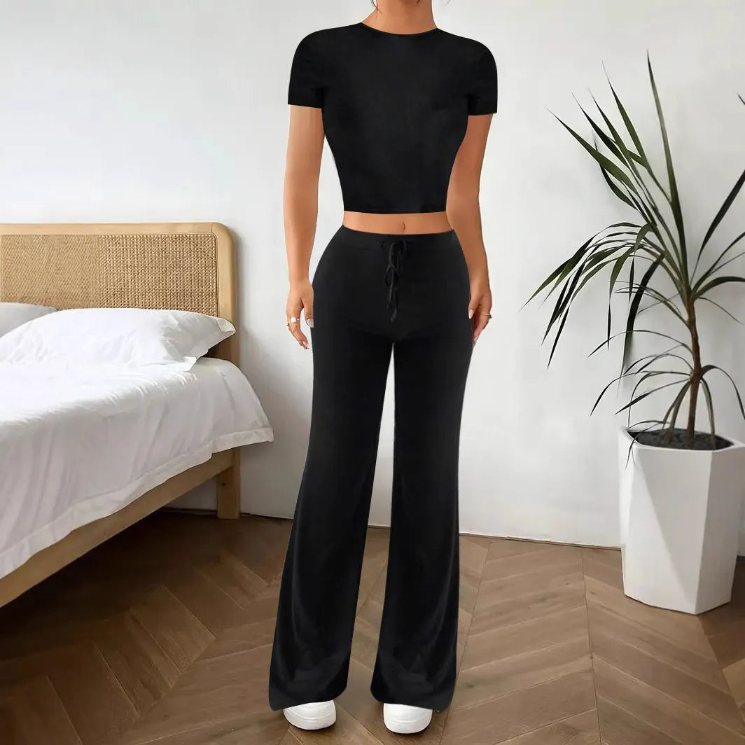 Black high waist trousers and short sleeve t-shirt suit set on a hanger
