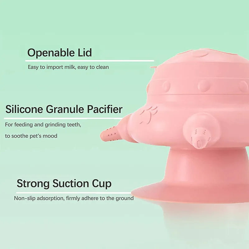 Pink silicone pet milk feeder with pacifier on a flat base, for puppies and kittens.
