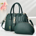 A round black PU crossbody shoulder handbag with a suitcase shape on a white background.