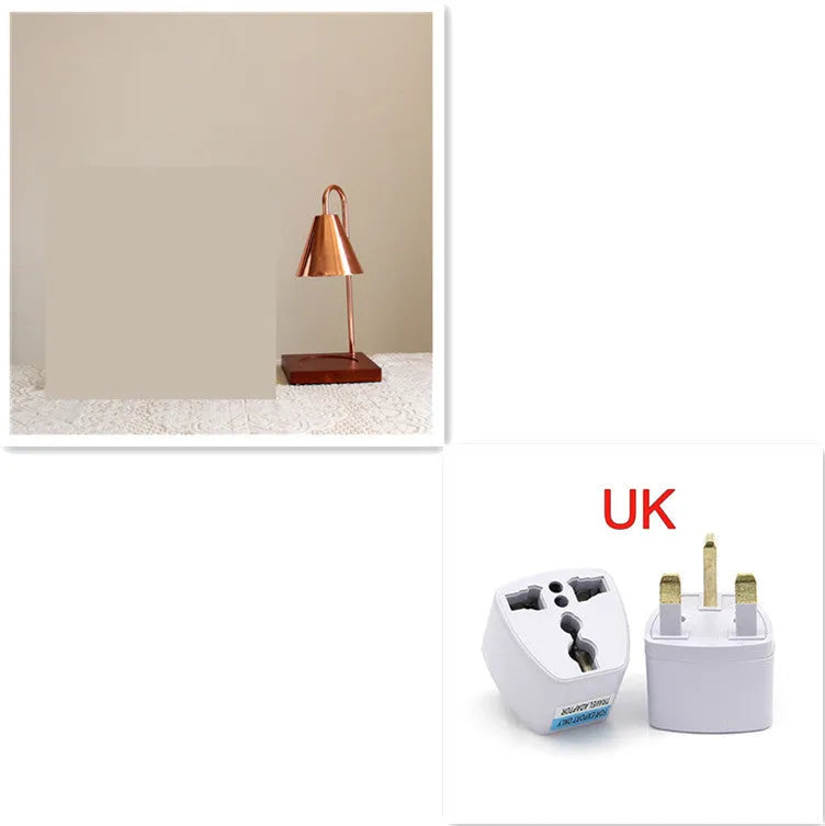 White and log coloured electric candle warmer lamp with dimmer switch on desk