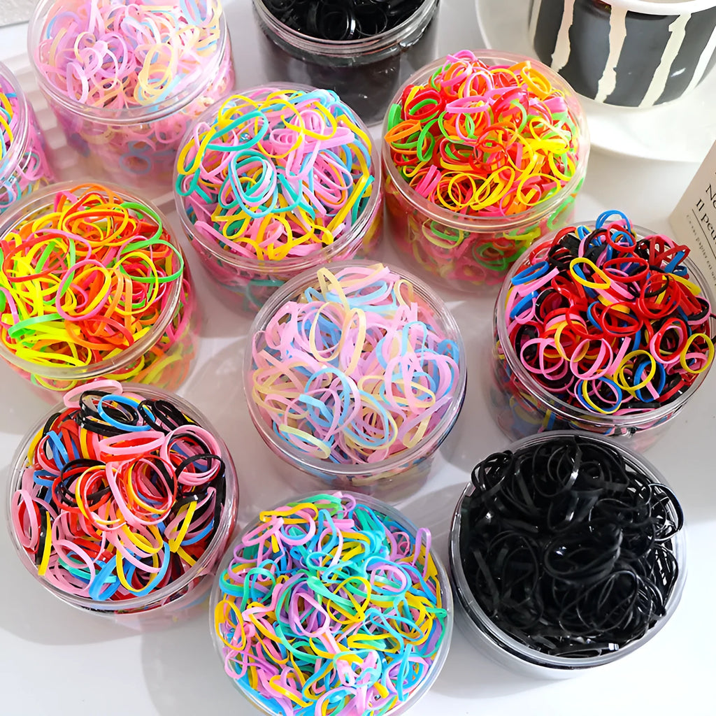 Multicoloured TPU baby hair ties in a reusable plastic container, pack of 300 or 600.