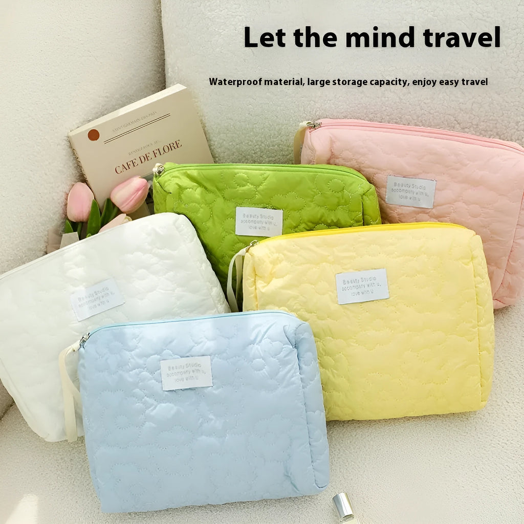 Silk quilted cosmetic bag in candy colours showing quilted pattern and storage capacity