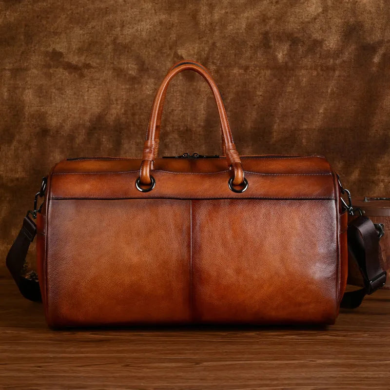 Brown retro style leather handbag made from first layer cowhide with large capacity.