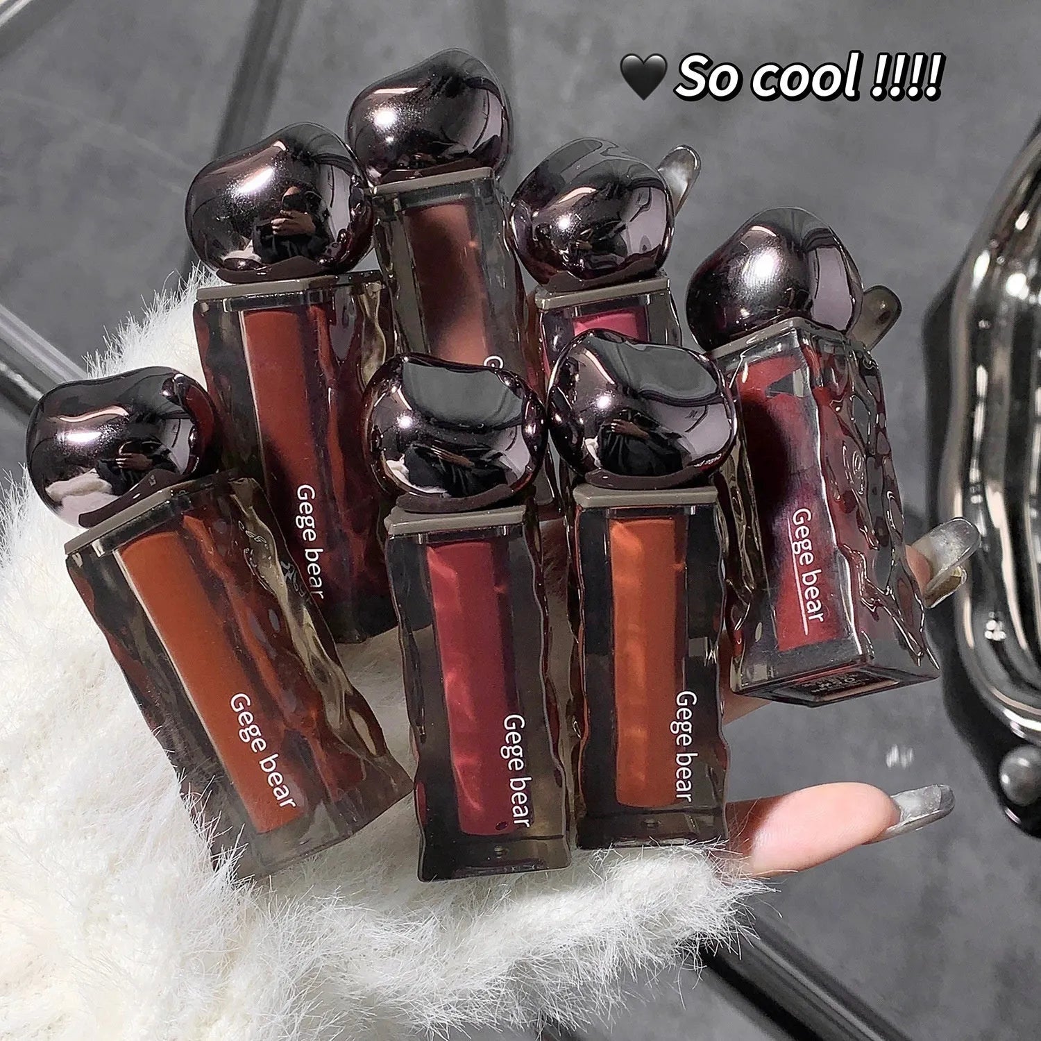 Glacier Lava Lip Lacquer in a tube showing its water light mirror gloss finish.