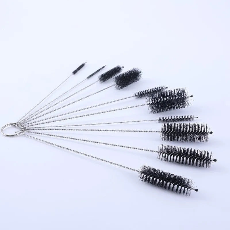 Set of stainless steel handled cleaning brushes with white nylon bristles for cleaning reusable straws.