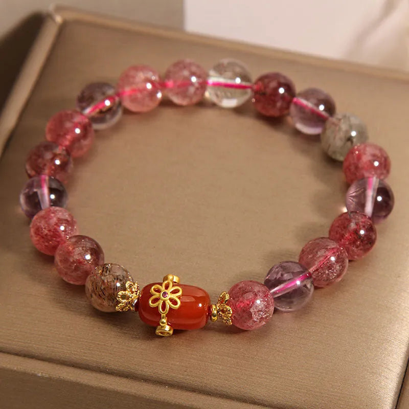 Super Seven crystal bracelet with white crystal and red agate accents on adjustable chain
