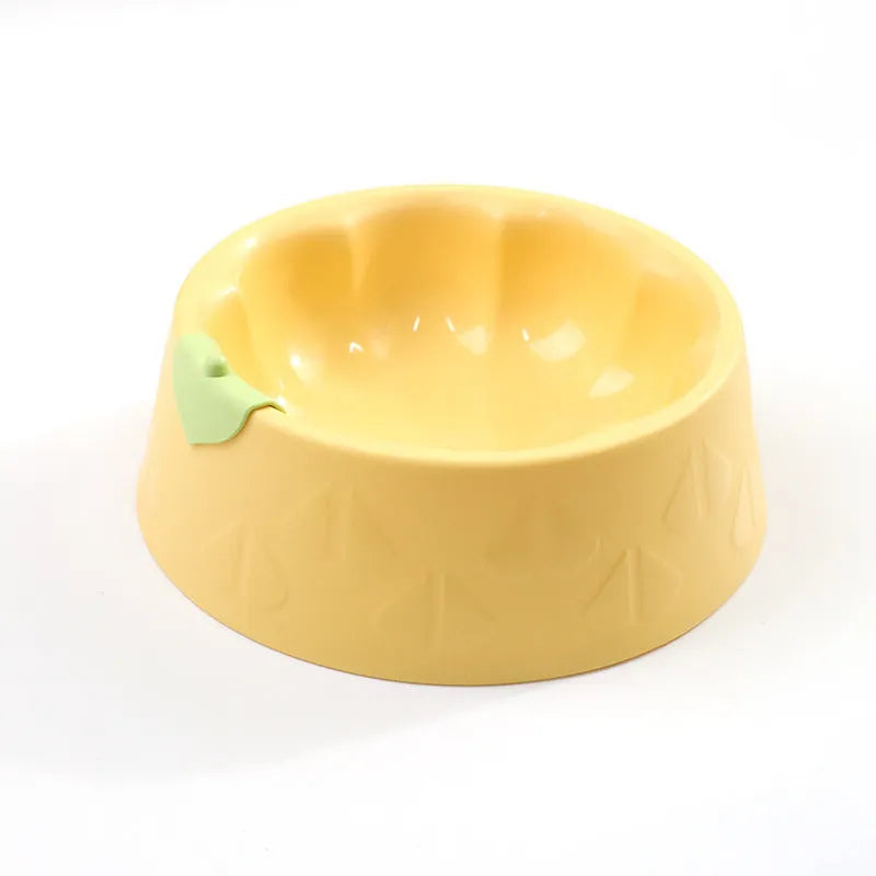Flower-shaped green plastic double pet bowl for cat and dog food and water on a white surface.