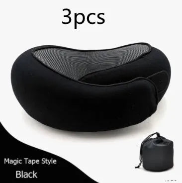 Navy blue U-shaped travel neck pillow with memory foam filling shown rolled and in its carry bag