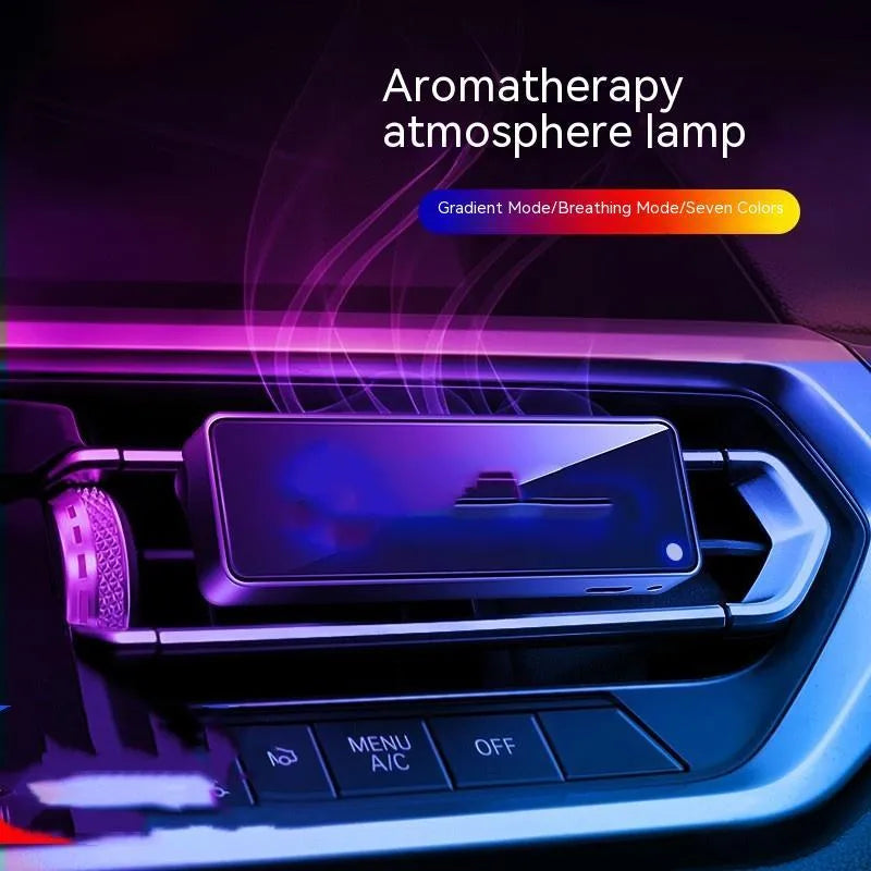 Black car air vent aromatherapy light with LED illumination and fragrance stick inserted