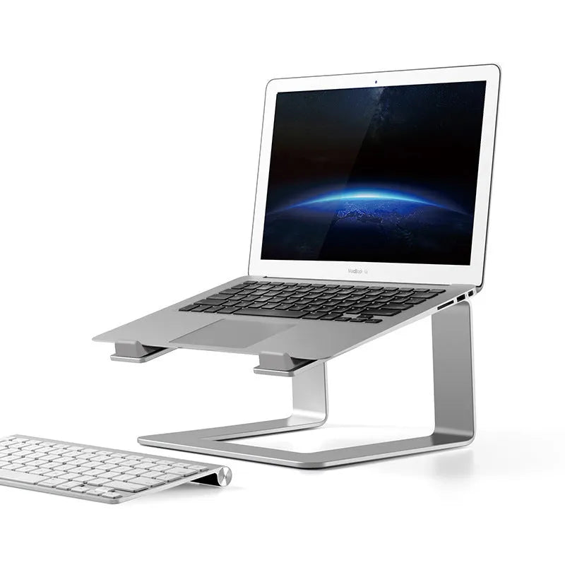 Aluminium alloy laptop stand in black or silver on a desk, showing its raised platform design.
