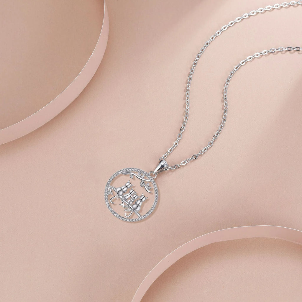 Original design copper cat pendant necklace with a cross chain, featuring a four kitten pattern.
