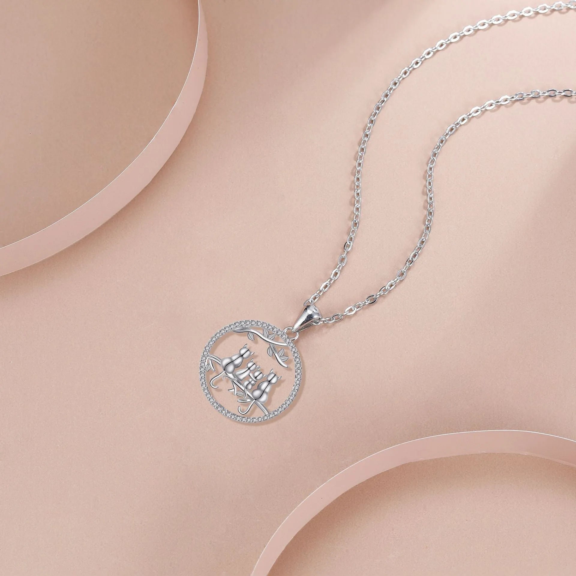 Original design copper cat pendant necklace with a cross chain, featuring a four kitten pattern.