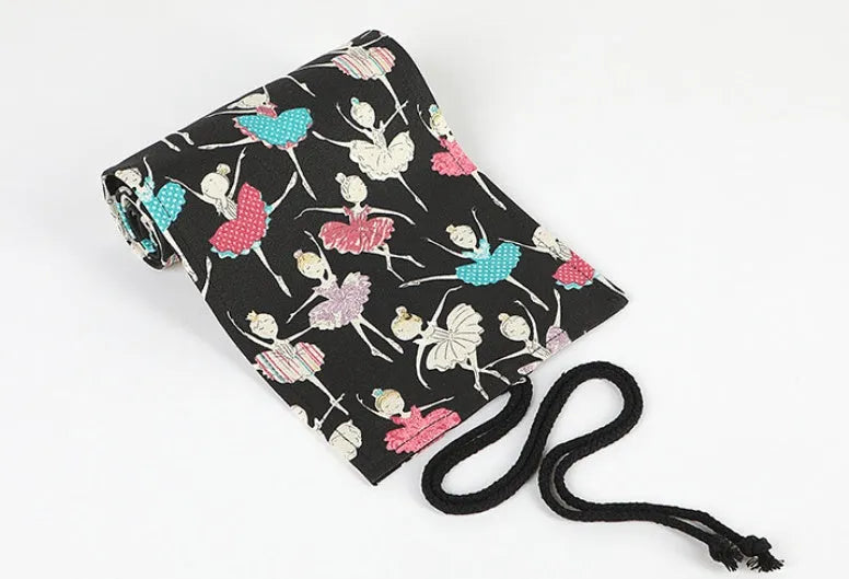 Canvas rolling pencil case with ballet girl print, shown open to reveal multiple pencil slots.