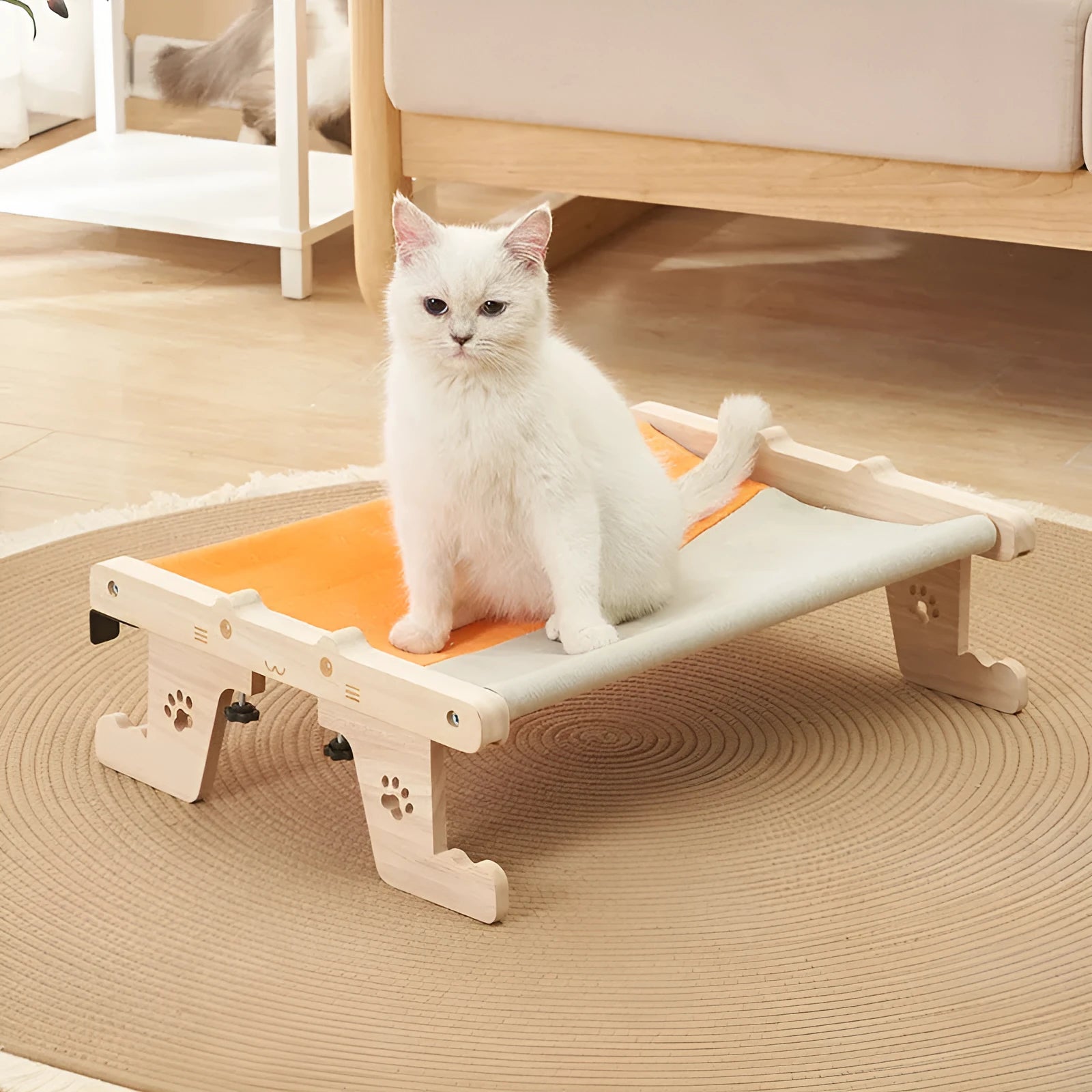 Wooden framed cat hammock bed hanging by a window, suitable for cats and small dogs.