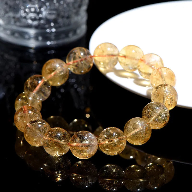 Natural yellow citrine bracelet with geometric beads in three colour grades, showing 15 size options from 4mm to 20.8mm diameter