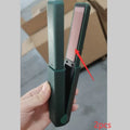 Pink and green cordless USB hair straightener with ceramic plates, shown with USB cable.