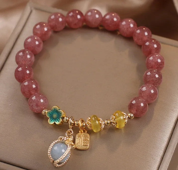 Red strawberry quartz beaded bracelet with alloy setting and rhinestone decoration