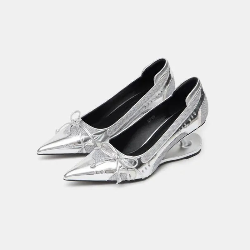 Women's black pointed toe Mary Jane shoes with a unique floating shaped heel