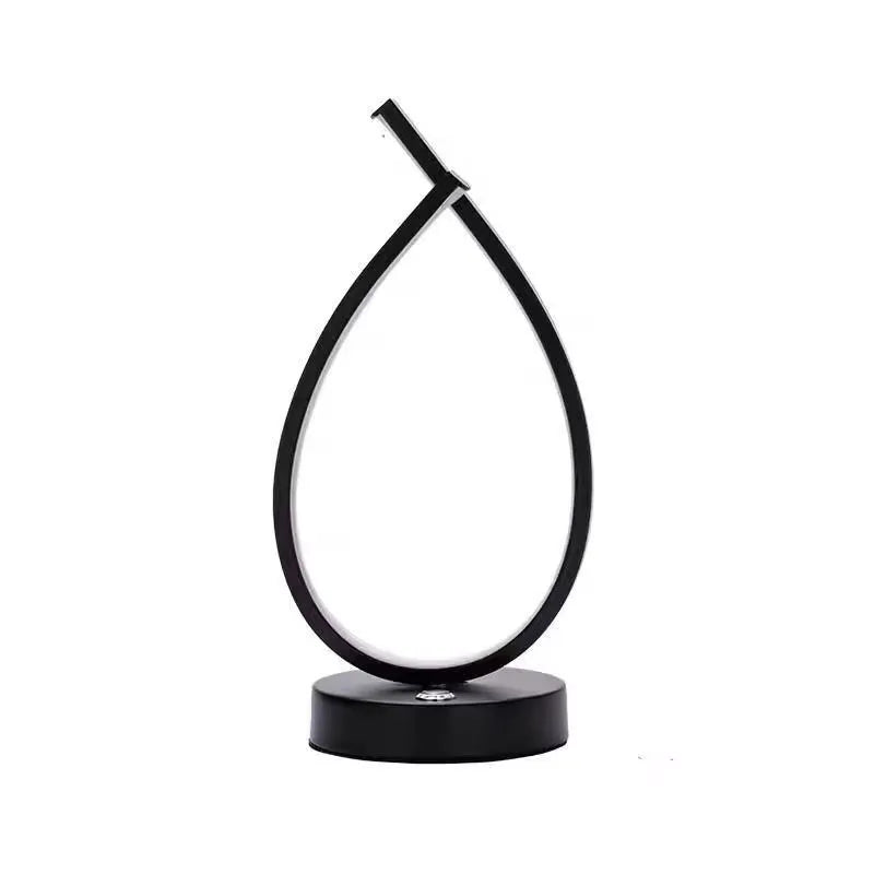 Small black or white creative desk lamp with USB cable, 30cm tall on a wooden table.