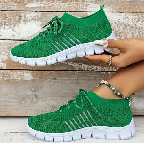 Women's breathable platform sneakers in multiple colours on a white background, showing lace-up front and flat rubber sole.