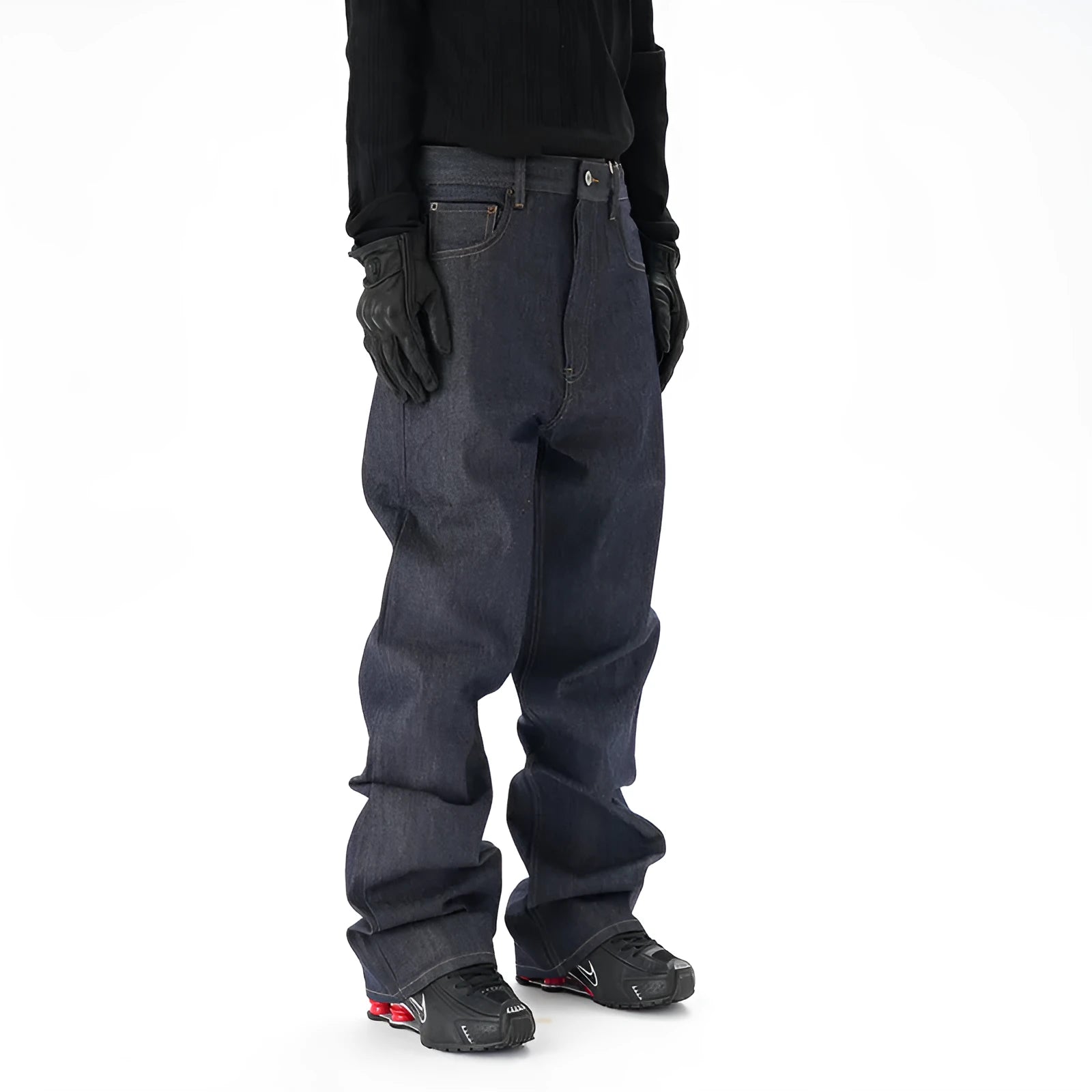 A pair of dark blue loose straight-leg men's jeans on a plain background.
