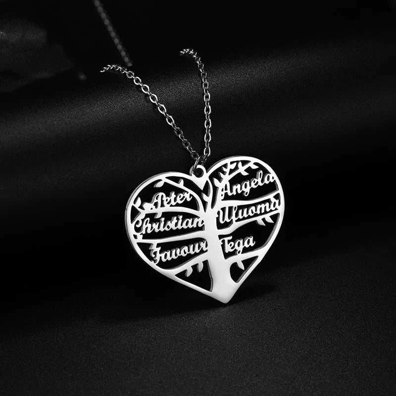 Personalised stainless steel necklace with hollow heart and tree pendant engraved with names, shown in silver finish.