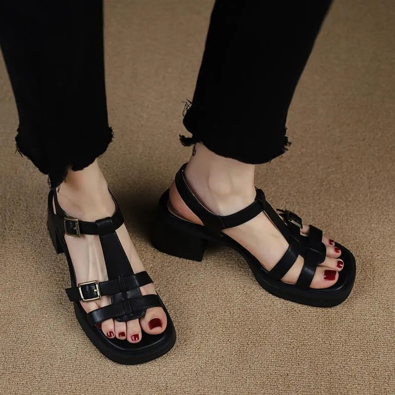 Women's black platform heel sandals with T-buckle ankle strap and open square toe design