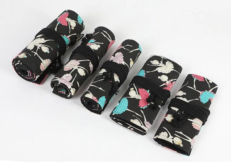 Canvas rolling pencil case with ballet girl print, shown open to reveal multiple pencil slots.