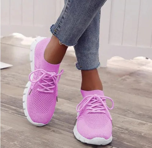 Women's breathable platform sneakers in multiple colours on a white background, showing lace-up front and flat rubber sole.