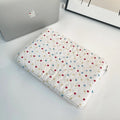 Women's polka dot polyester laptop bag shown in three sizes for 11-inch, 13-inch, and 15-inch laptops.