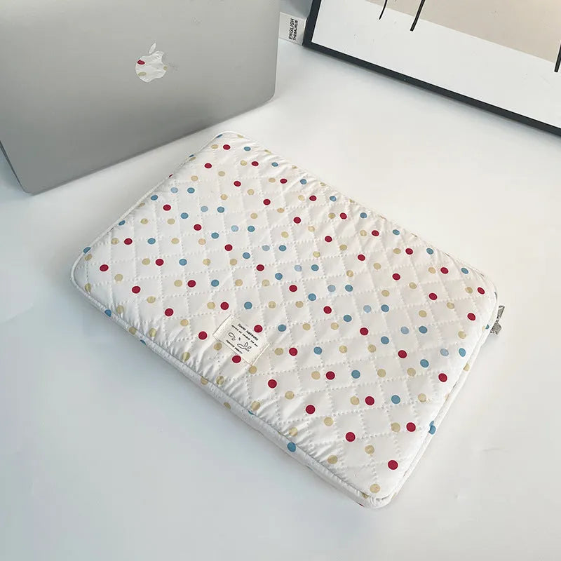 Women's polka dot polyester laptop bag shown in three sizes for 11-inch, 13-inch, and 15-inch laptops.