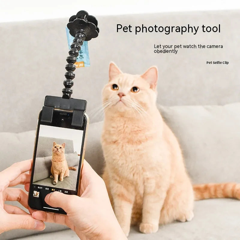 Black pet photography tool with rotating clip and snack holder for mobile phone cameras