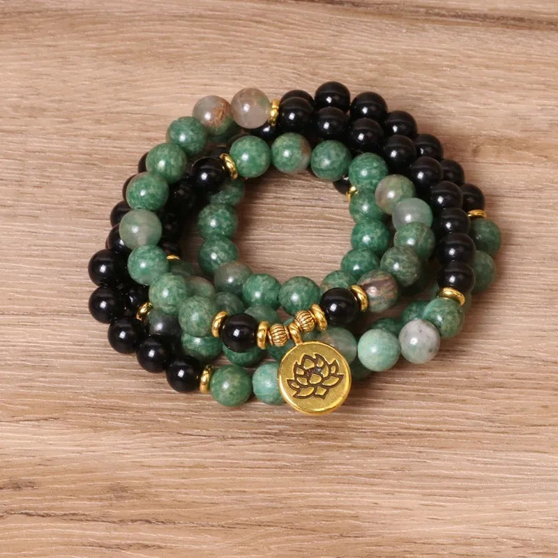 Green and black elastic beaded long bracelet with alloy material and adjustable sizing