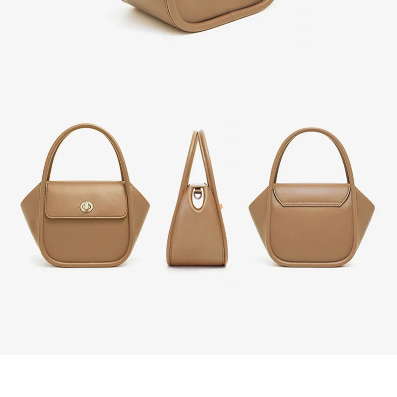 Leather tote cross-body wing bag in soft cow leather with latch closure and wing shape design.