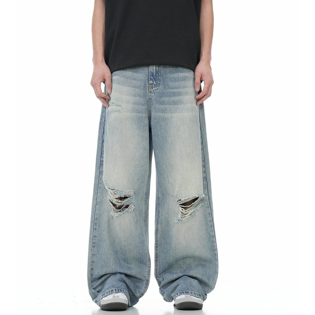 Blue straight-leg ripped jeans with zipper fly, made from inelastic cotton-blend fabric, sizes S to XXL