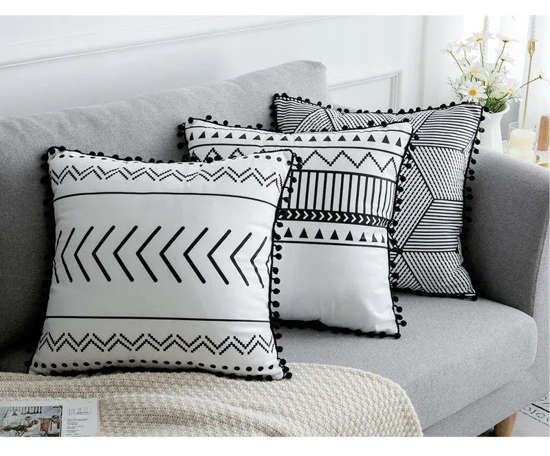 Bohemian National throw pillow in light grey colour with 30x50cm rectangular shape on living room sofa