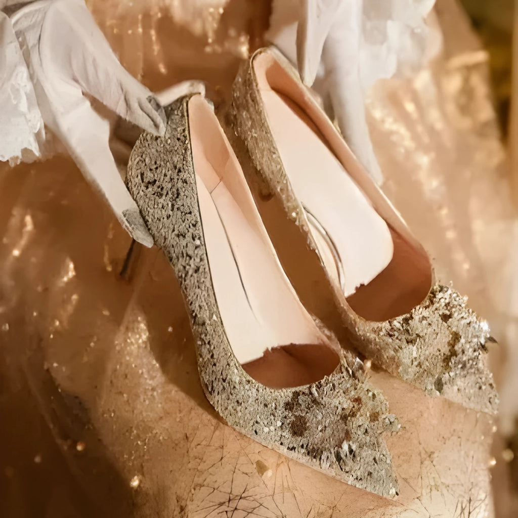 Champagne Xiuhe wedding shoes with rhinestone flower pattern and pointed toe on a fine heel.