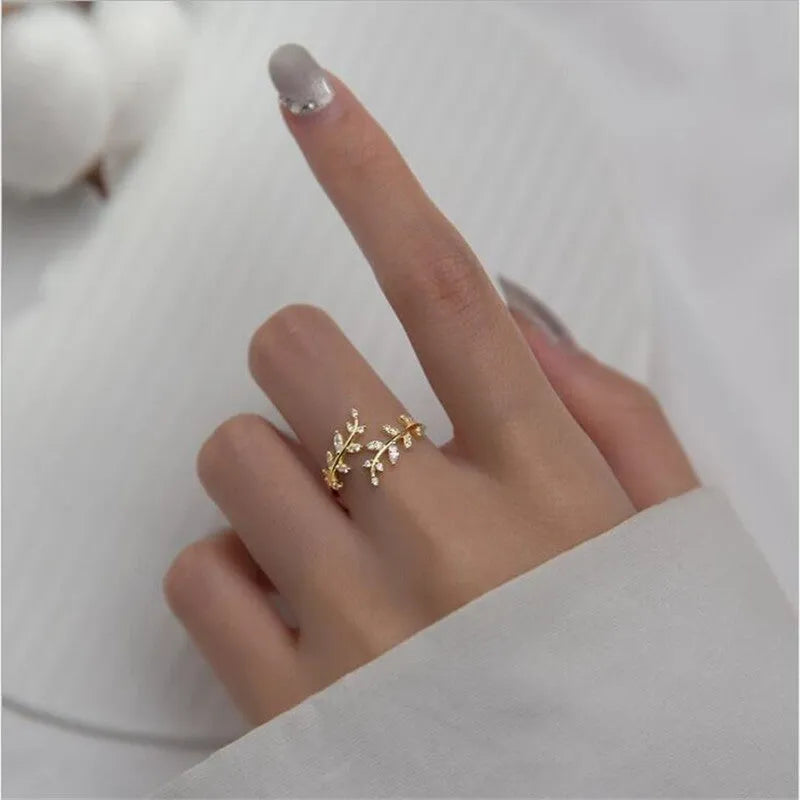 Copper leaf branch fashion ring for women with electroplated gold or silver finish.
