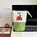 Brown collapsible pencil case with Korean-style cartoon design showing 17x14cm dimensions and Oxford fabric texture