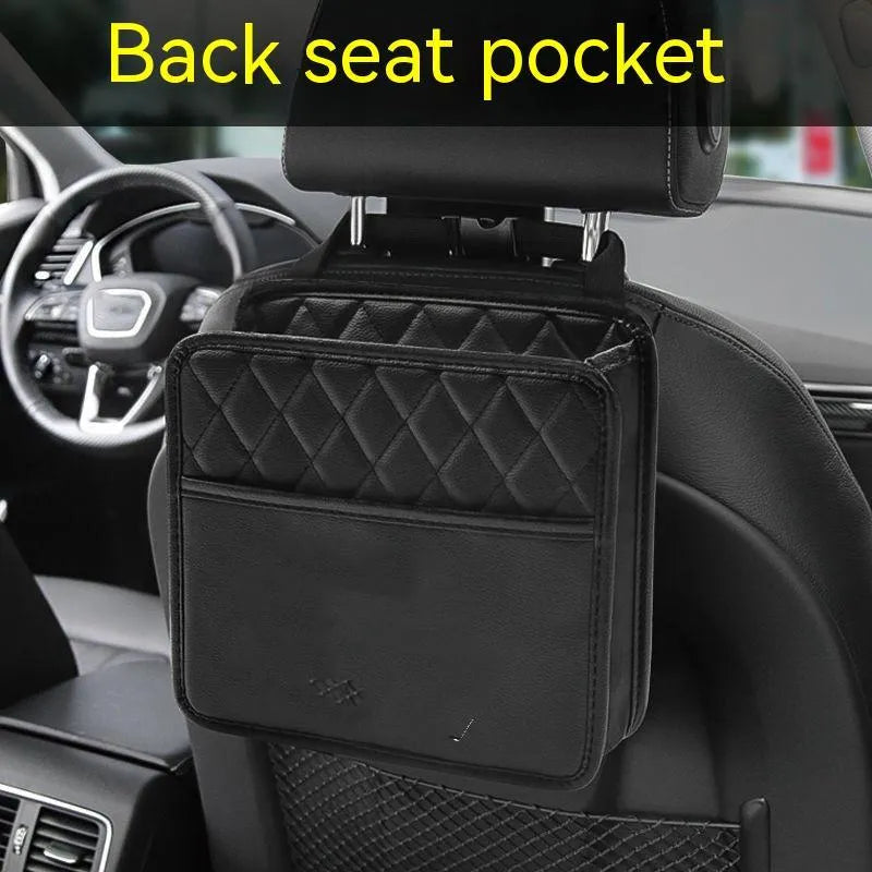 Black leather hanging car storage bag measuring 25x25x8cm attached to car headrest